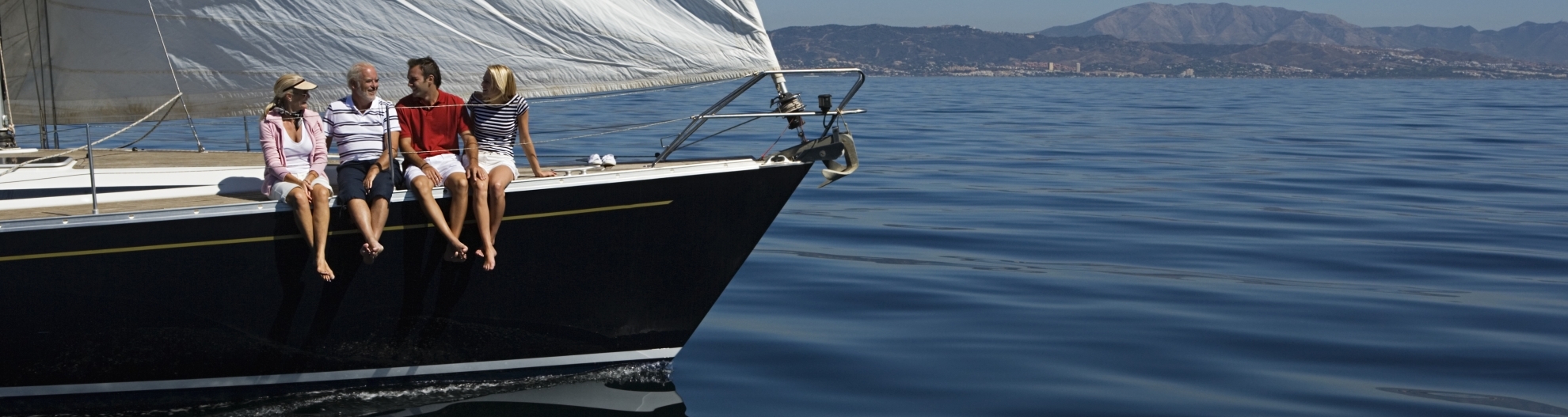 Four People Sat on a Sailboat
