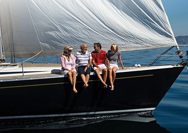 Family on sailboat during summer day